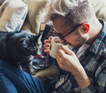 A resident relaxes with their cat as part of Kardon Atlantic’s pet-friendly policy